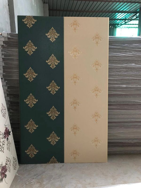 Two decorative panels with elegant gold patterns, one dark green and one cream.