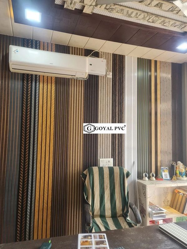 Office interior with striped wall panels and an air conditioner.