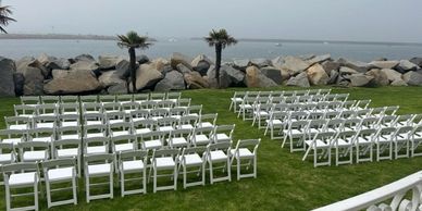 We did a set -up of our white padded  resin chairs for a  lovely couple on their wedding day. 