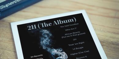 Polaroid photo featuring album details for Slick 2H Rick's "2H (The Album)".