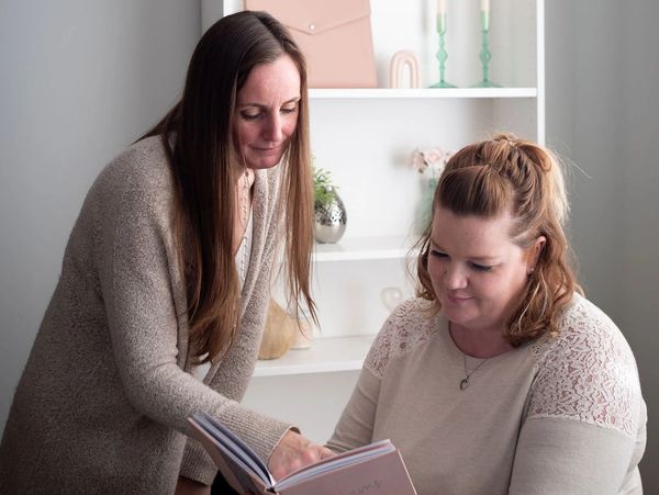 Jessica Armstrong & Shellie Munro Digital Marketing Specialists collaborating in office