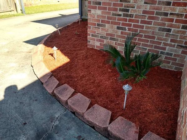 Quality garden mulch application for weed suppression and soil insulation.