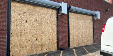 24 hour emergency board up service. Overhead garage doors boarded up and secured.