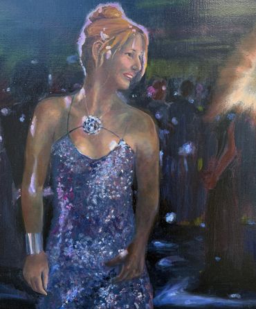 A woman in a sparkling dress smiling amidst a dark, crowded background.