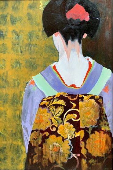 Back view of a woman in traditional Japanese attire with floral patterns.
