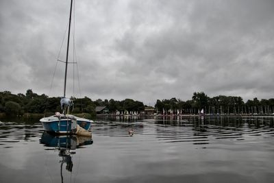 Laser 16 at mooring, looking toward the clubhouse.