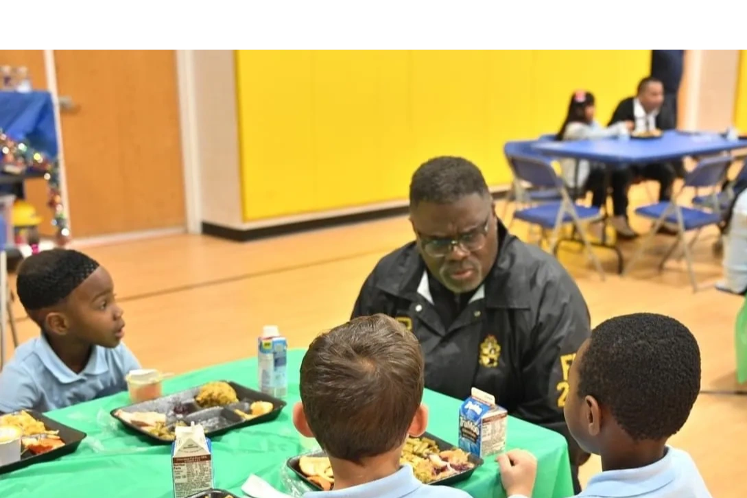 Servants of All mentors sharing lunch and knowledge with the students of our community.