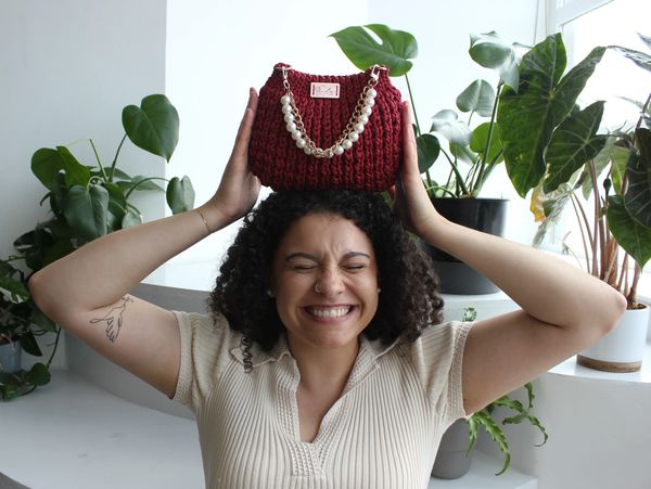 a woman carrying a COUTURE on her head 