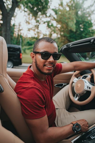 Latin young man driving. Learning how to drive.