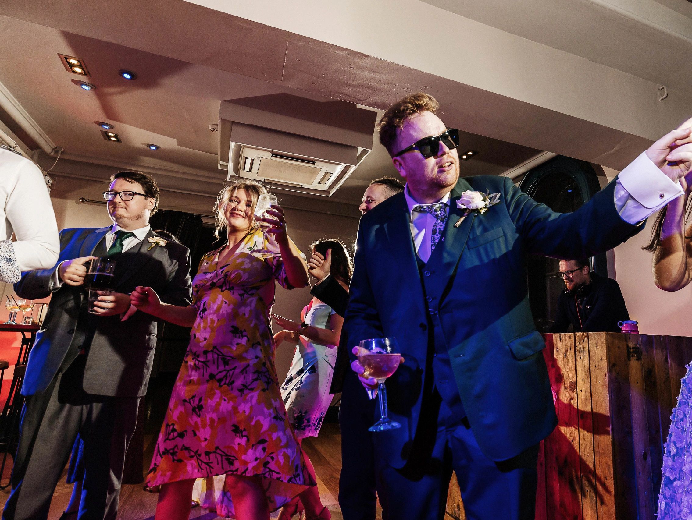 Groom with shades at Leeds wedding on dancefloor 