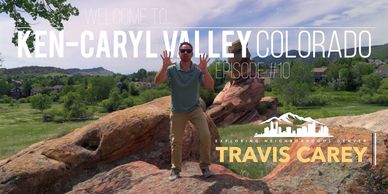 Man posing on rocks in Ken-Caryl Valley, Colorado.