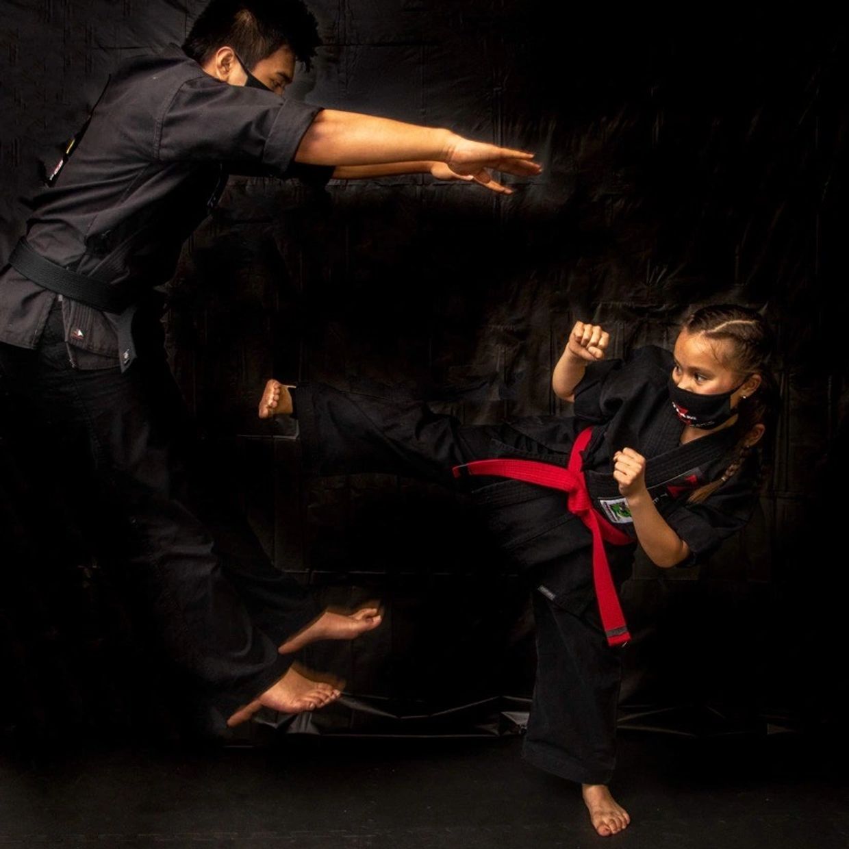 Youth kids benefiting with martial arts classes and learning self-defense. 