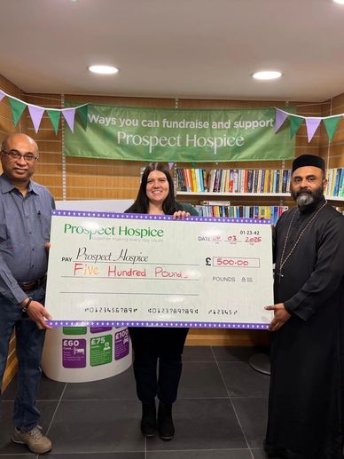 Three people holding a large £500 cheque for Prospect Hospice.
