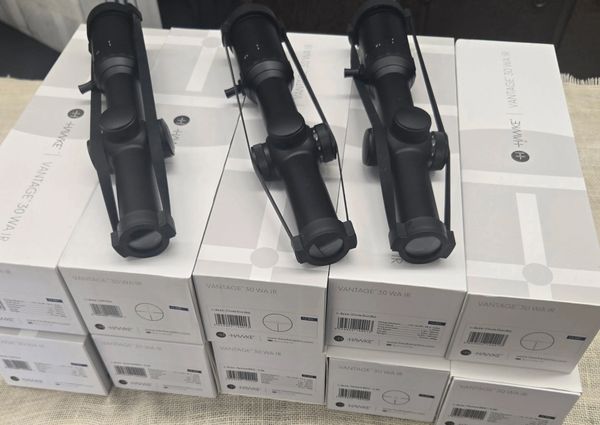Three rifle scopes displayed on boxes labeled Vantage 30 WAIR.