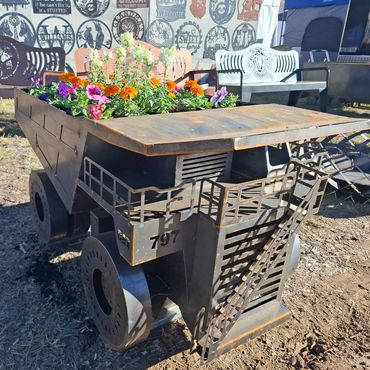 Flower planter designed like a mining truck.