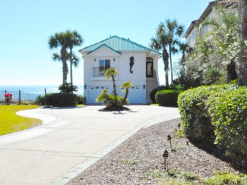 Beachfront house with long circle drive and two car garage for extra parking. 
