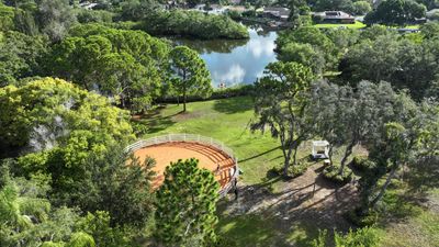 A still taken from drone footage of the property from above, featuring the round pen and cove