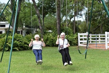Seniors smile on swing during senior activities