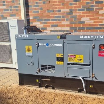 large generator supplying full power to house and workshop kicking in automatically on mains loss
