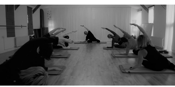 Pilates  class Group exercise Warm up relaxation core stability spinal mobility Mermaid flexibility