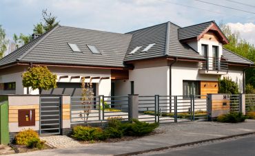 Modern house with a gated fence.