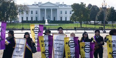 Women protest in front of the White House for equal rights and ERA ratification.