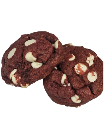 Three red velvet cookies with white chocolate chips.
