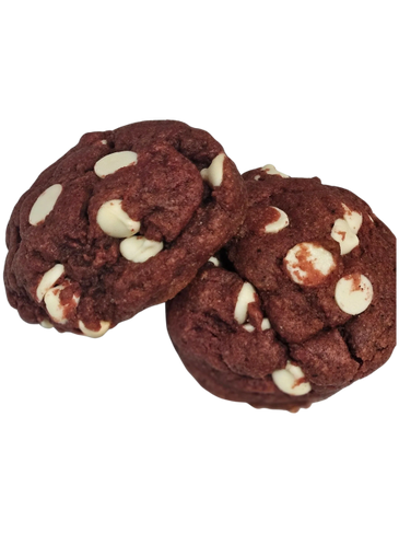 Three red velvet cookies with white chocolate chips.
