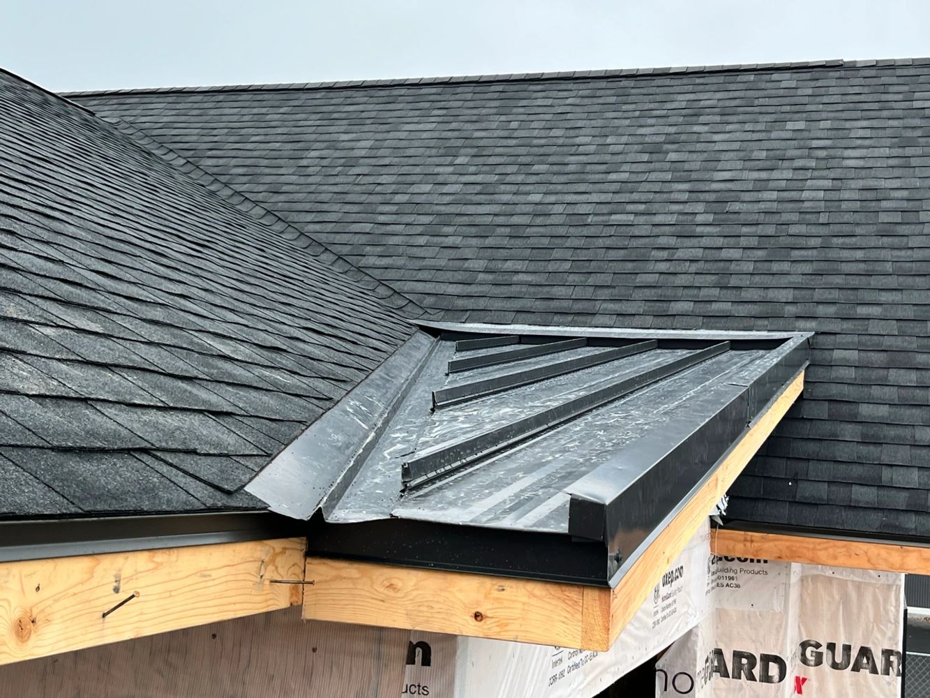 Joining metal and shingles for a clean, watertight finish. 
