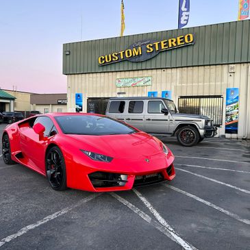 California Custom Stereo Shop in Fresno Ca with a red Lamborghini and a Mercedes G-Wagon
