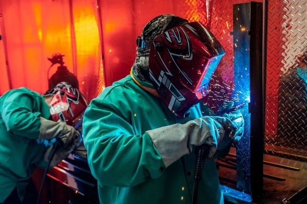 Group of WorkForce Innovators men welding in an industrial workshop

