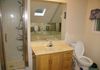 A bathroom with a bathtub located on the top floor