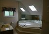 A bathroom with a bathtub located on the top floor
