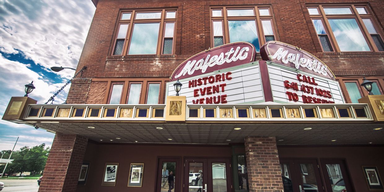 Front view of The Majestic Theater with a marquee message promoting the historic event venue.