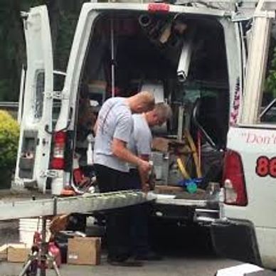techs from NJ Home Maintenance Services making Rain Gutter with gutter machine in van Wayne NJ 07470