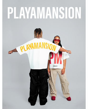 Two models showcasing PLAYAMANSION branded streetwear in a studio.