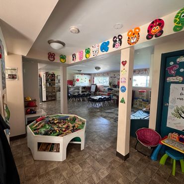 Colorful and inviting preschool classroom with child-friendly decorations and furniture.