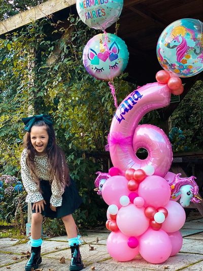 Unicorn theme balloon stack for a 6th birthday