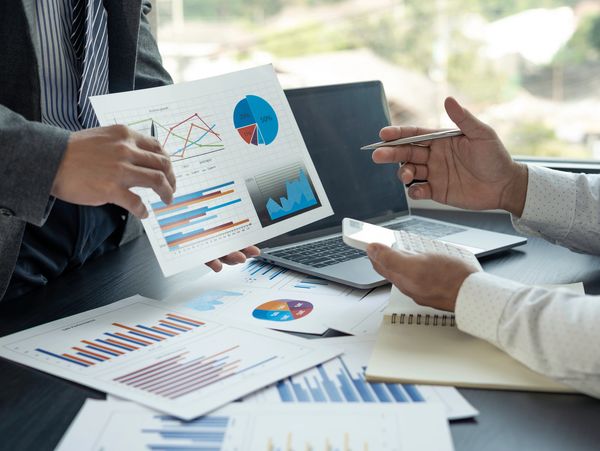 An accountant showing financial reports to a client