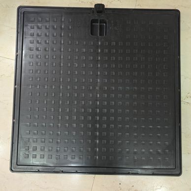 Square black textured plastic cover with a handle.