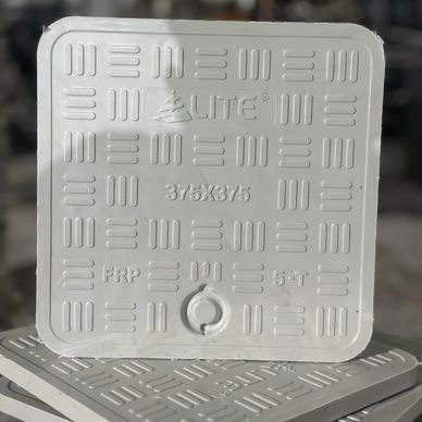 Square GRP manhole cover with text and pattern.
