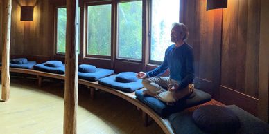 Anu Peter meditating in the meditation hut at Esalen in Big Sur, California.