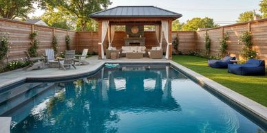Modern backyard with a pool, lounge area, and cozy seating under a pergola.