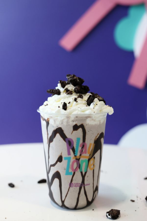 Cookies and cream milkshake with whipped cream.