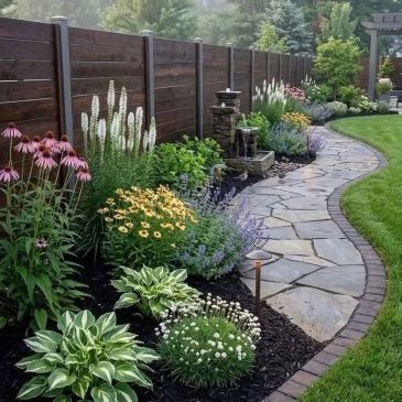 Beautiful garden path with flowers and stone walkway.