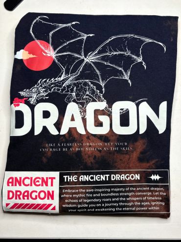 T-shirt with a fierce dragon graphic and text about ancient dragons.