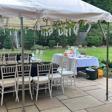 Outdoor marquee party event, in Woking garden, patio area, table and chairs
