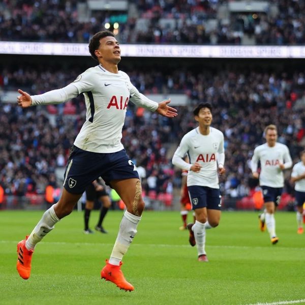 Tottenham soccer player celebrating a goal during a match.