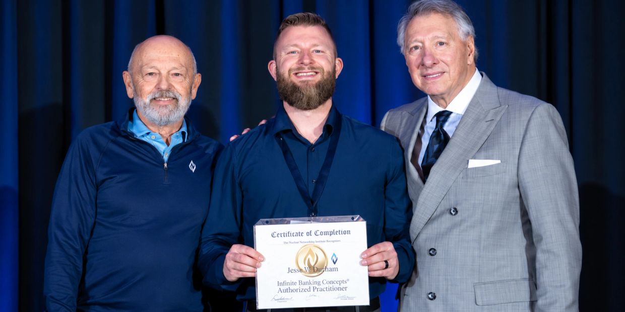 Three men pose with a certificate of completion.