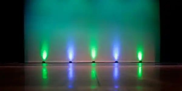 Colorful stage lights with reflected glow.